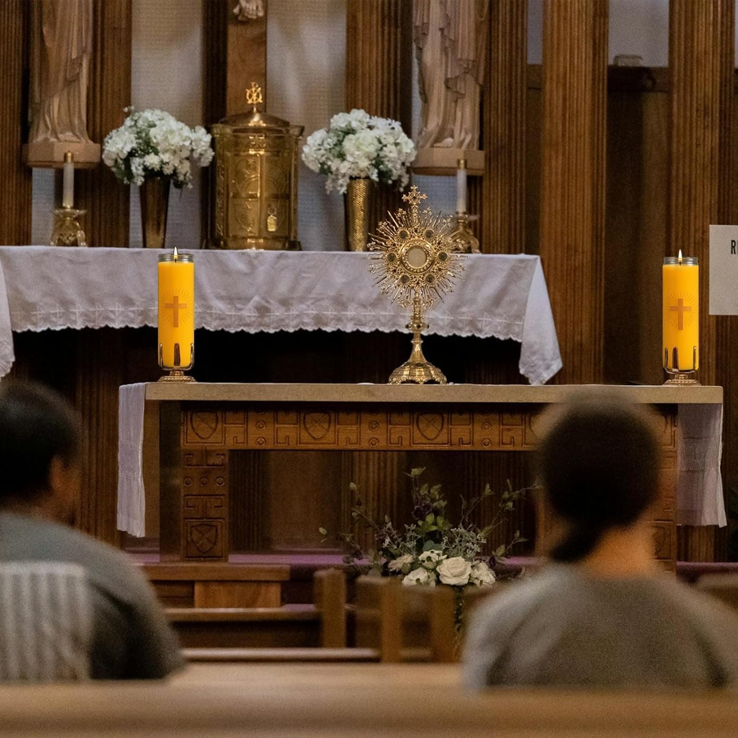 Anovia devotional candles on a church altar during service